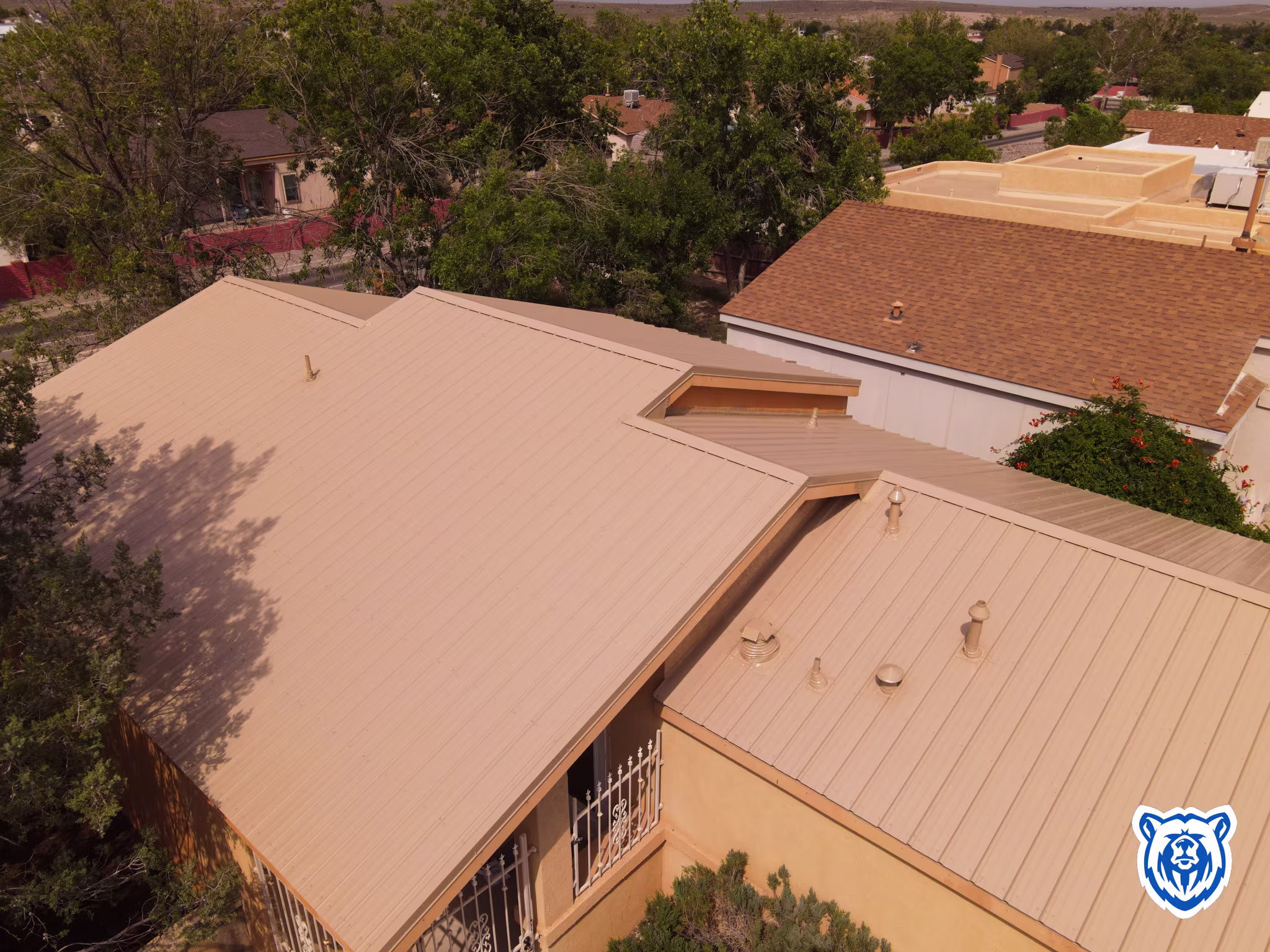 Metal roof replacement in Rio Rancho, NM - saddle tan panels
