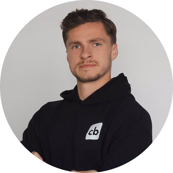 Young man wearing a black coachbetter hoodie