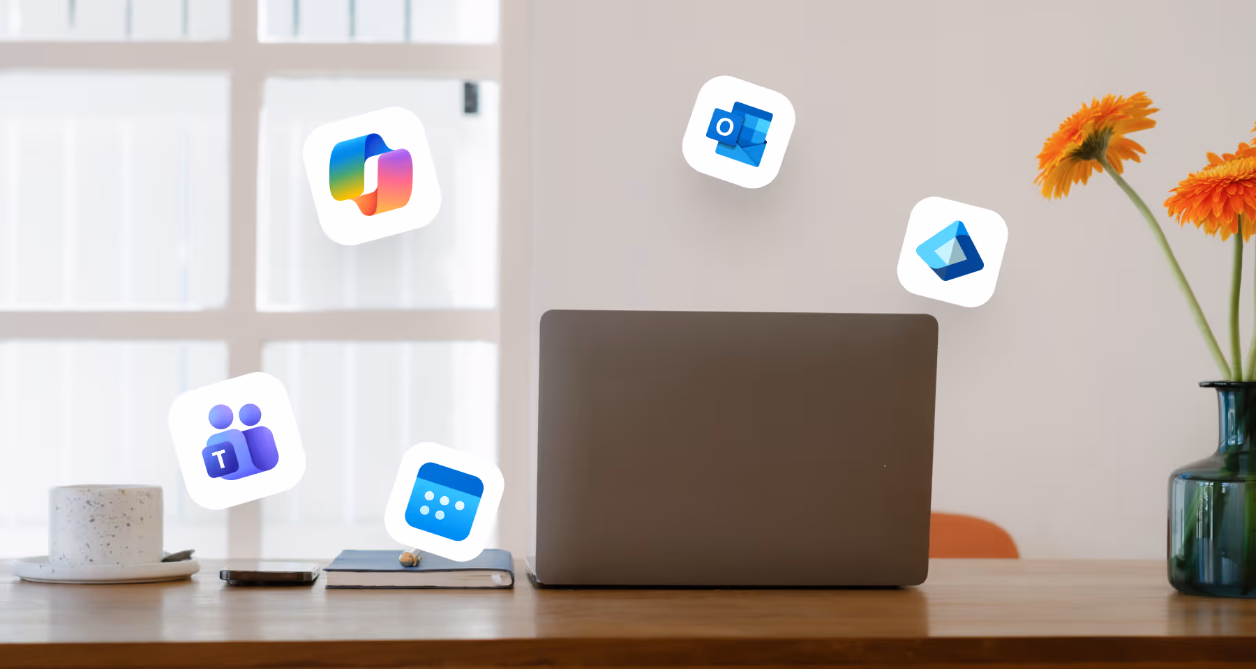 Closed laptop on a wooden desk with a notebook, phone, coffee cup, and floating Microsoft 365 app icons.