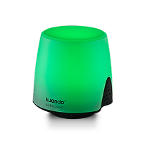 Green glowing Kuando Busylight device with black base on black background.