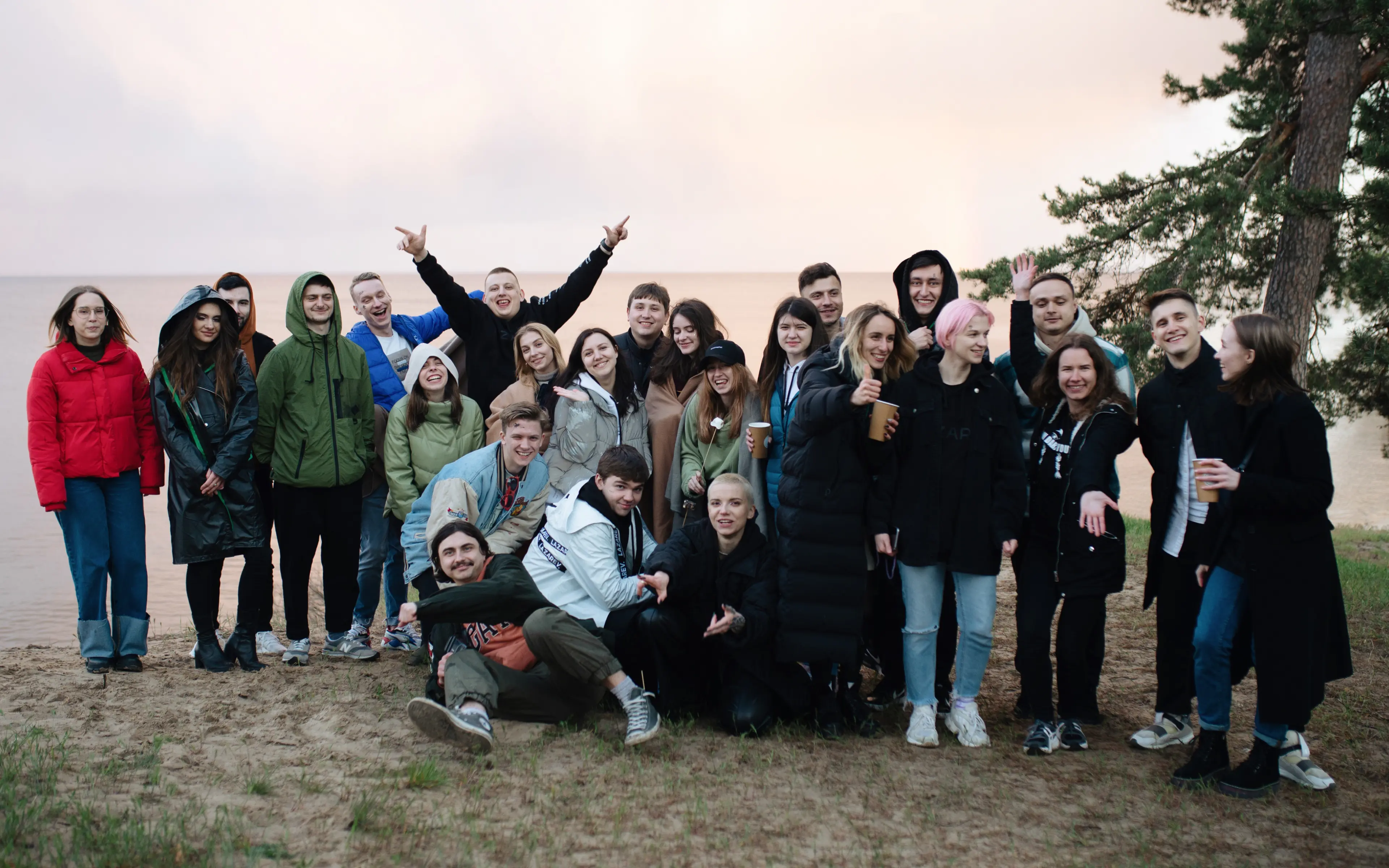 Lazarev.agency team is smiling and posing for the camera at their corporate party.