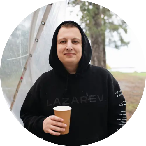 Lazarev.agency CEO drinking a cup of coffee in the forest.