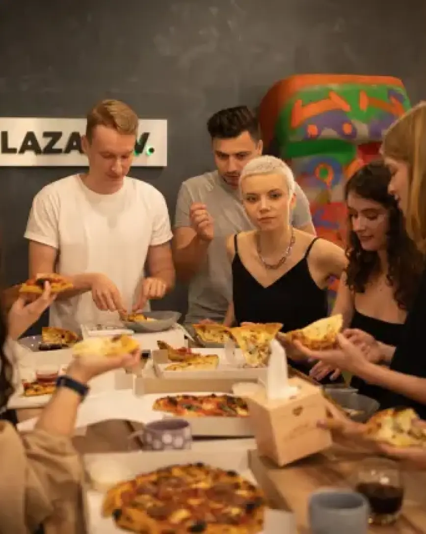 Lazarev.agency Team Enjoying Pizza Lunch Together