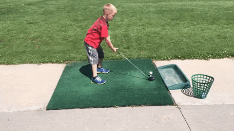 kid playing golf