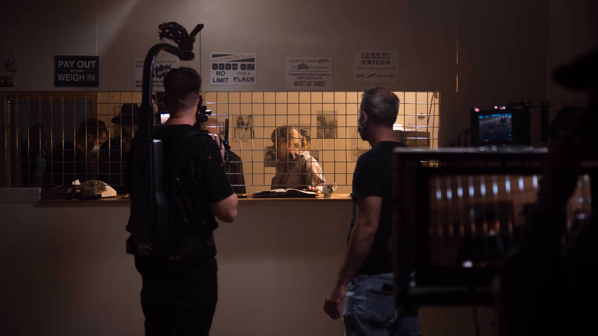 Film crew shooting in a bar scene
