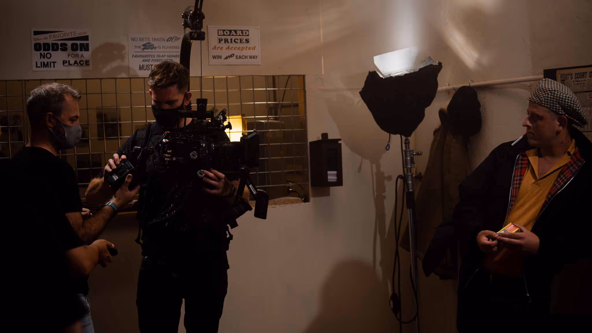 Behind-the-scenes filming with crew.