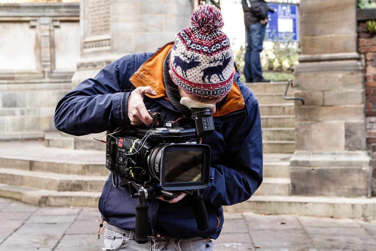 a man shooting a film in a video production company