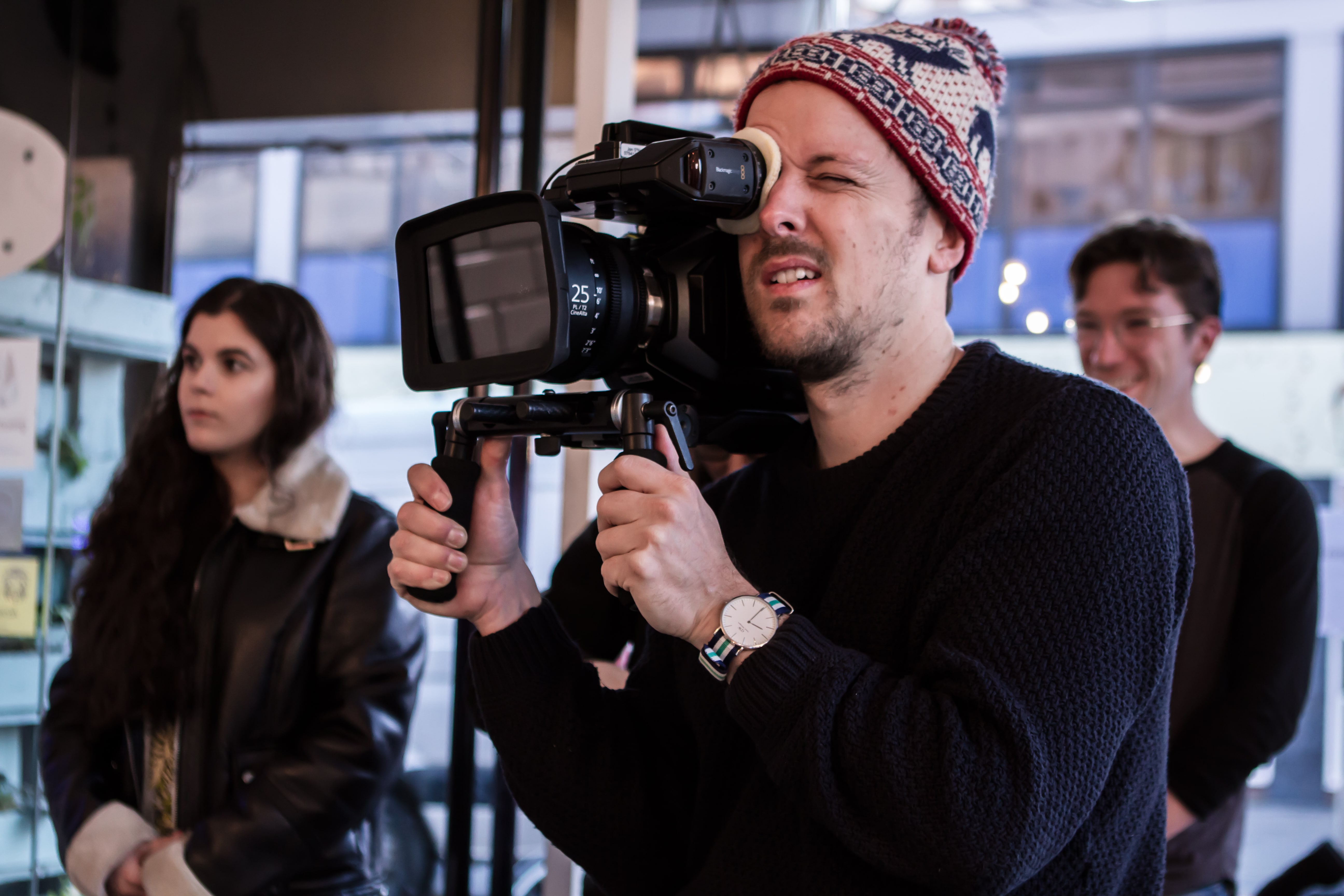 Crew filming with camera equipment during production.
