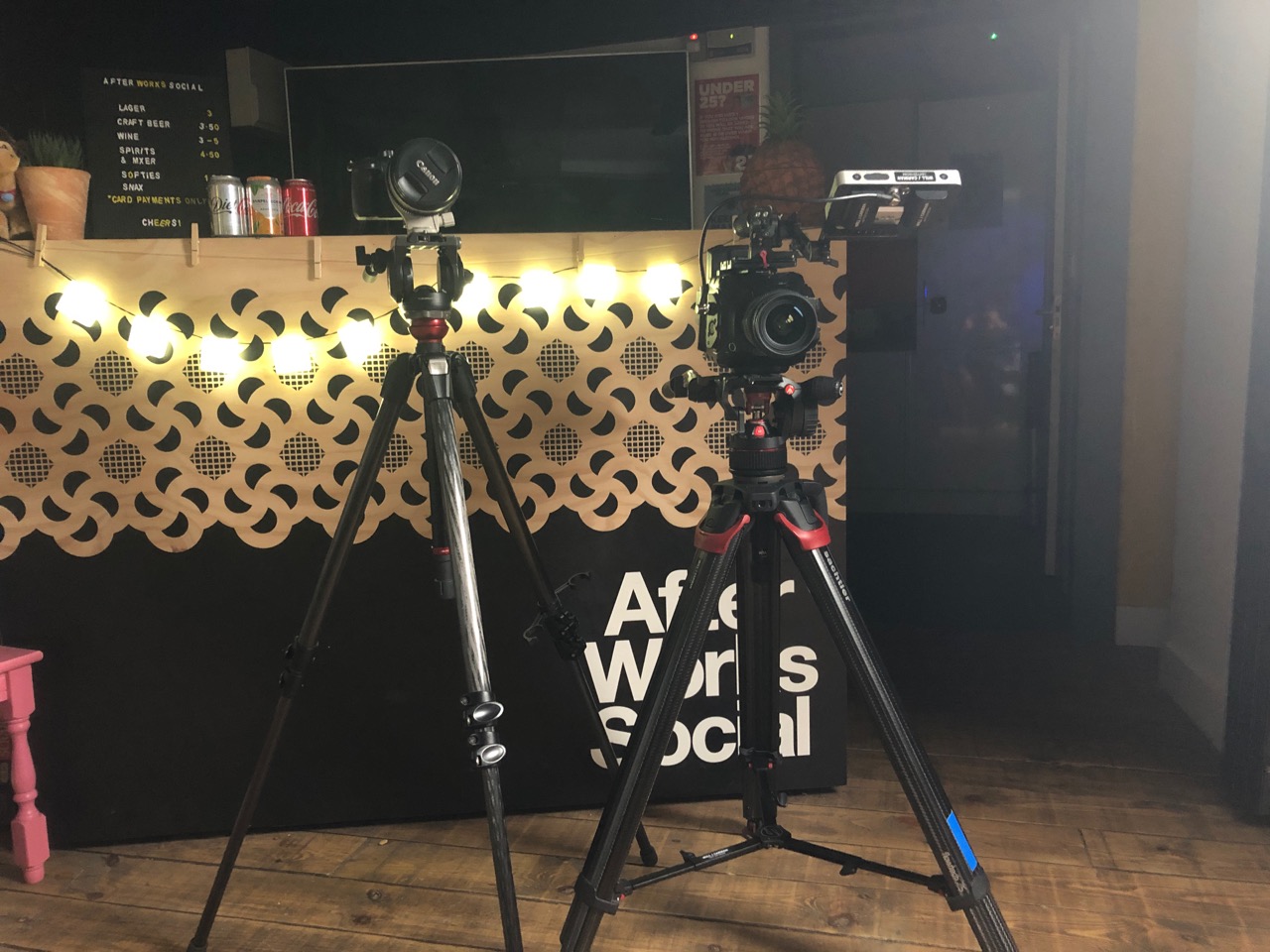 Professional camera setup on tripod in studio.