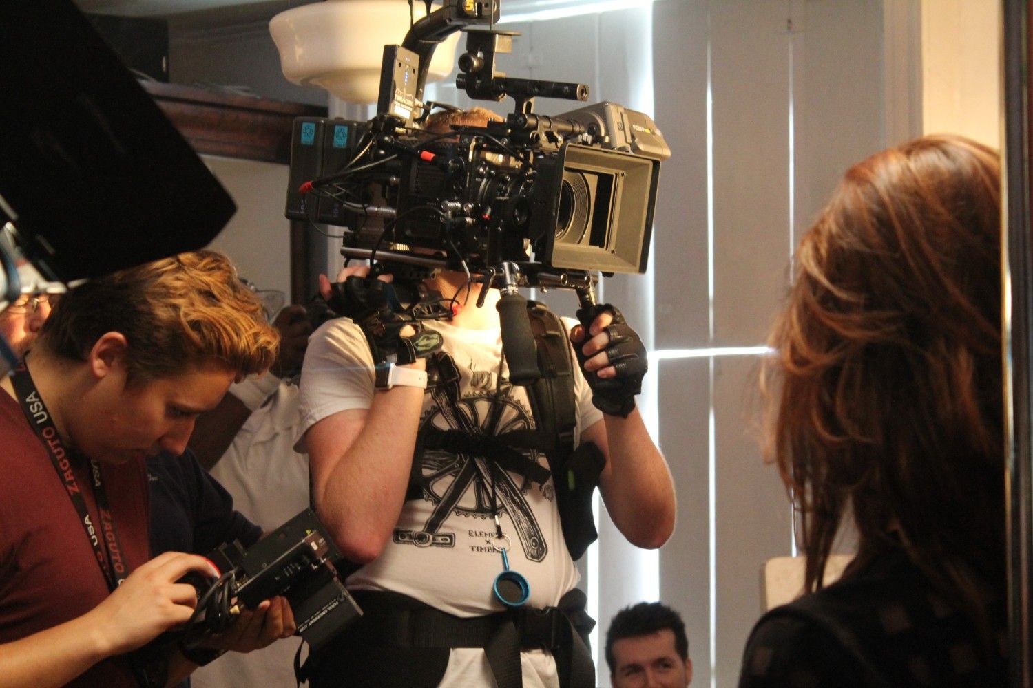 Crew operating professional video cameras during a shoot.