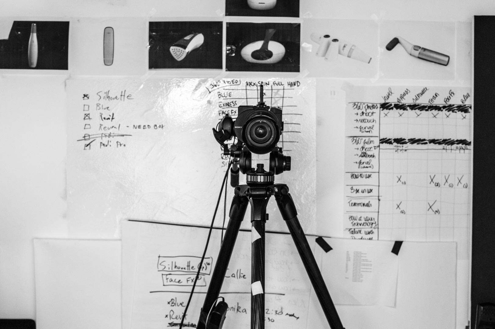 Sony camera on tripod in front of a video production planning board during pre-production