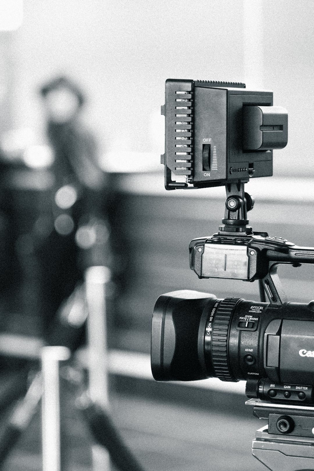 Canon video camera with on-camera light on a live action video production shoot