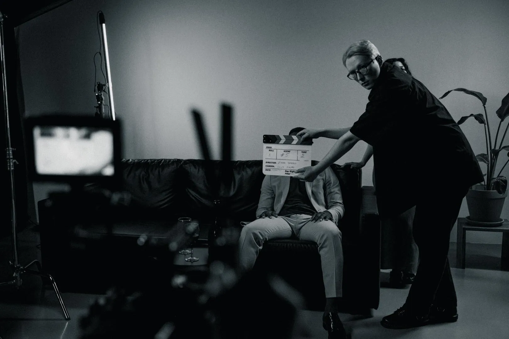 Behind-the-scenes shot of a scripted video production shoot showing crew complexity