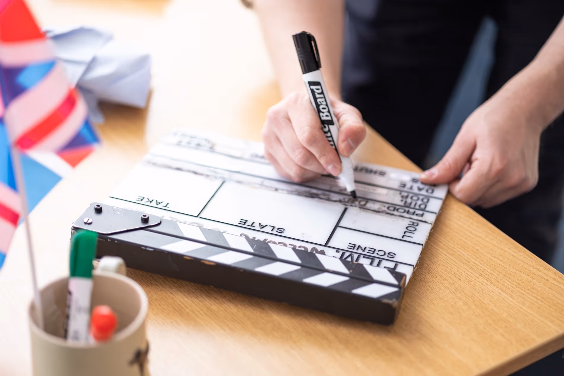 Clapperboard being marked up on set during a MedTech video production