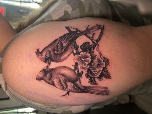 Tattoo of skull with butterflies