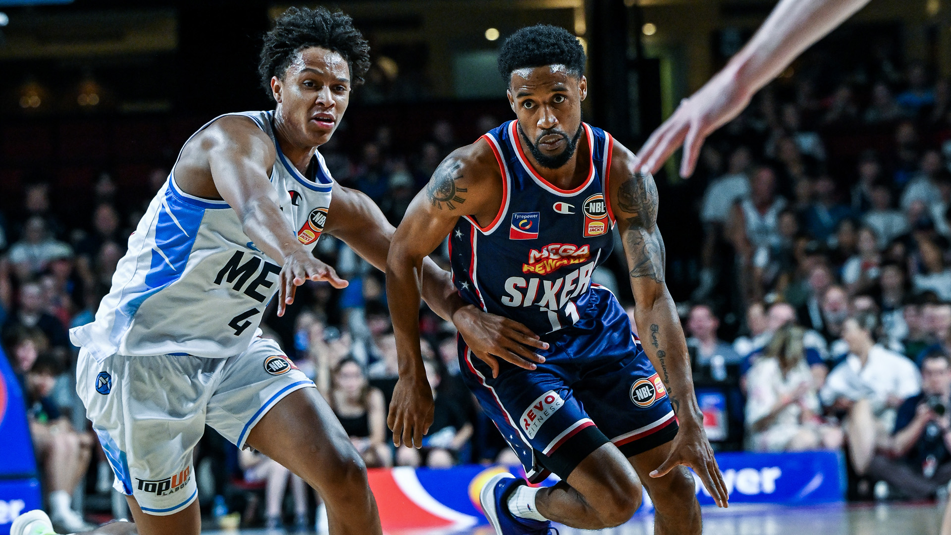 Sixers prevail in OT in clash for top spot