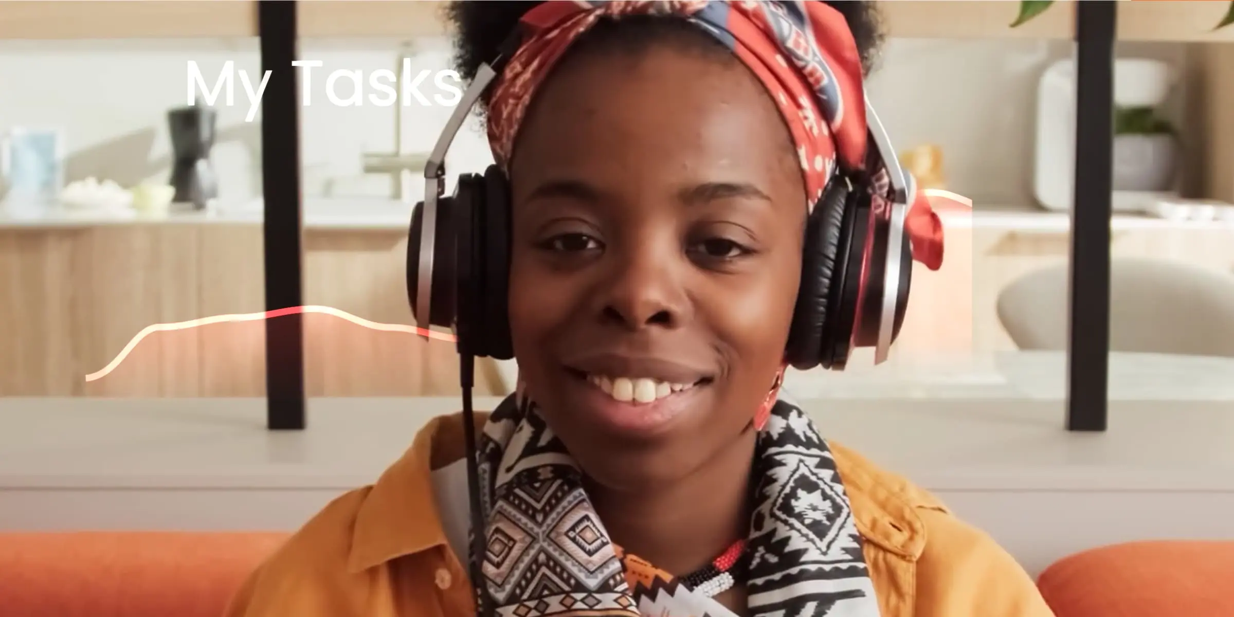 A girl in an orange jacket sitting in the earpads and listening to music.