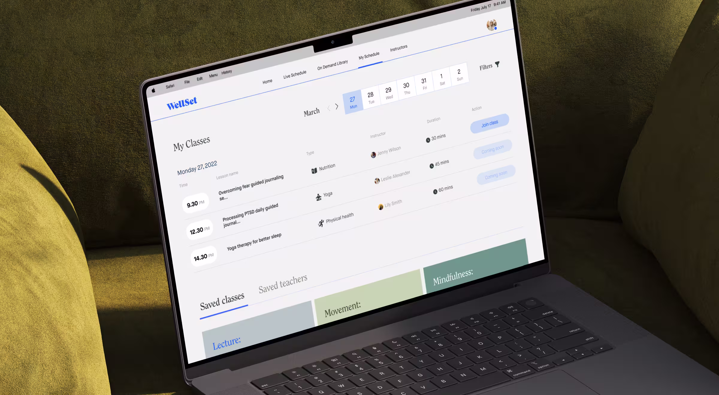 A laptop displaying the WellSet platform interface, showing a user's class schedule with times, class titles, instructors, and durations. The screen highlights wellness sessions like yoga therapy and guided journaling.
