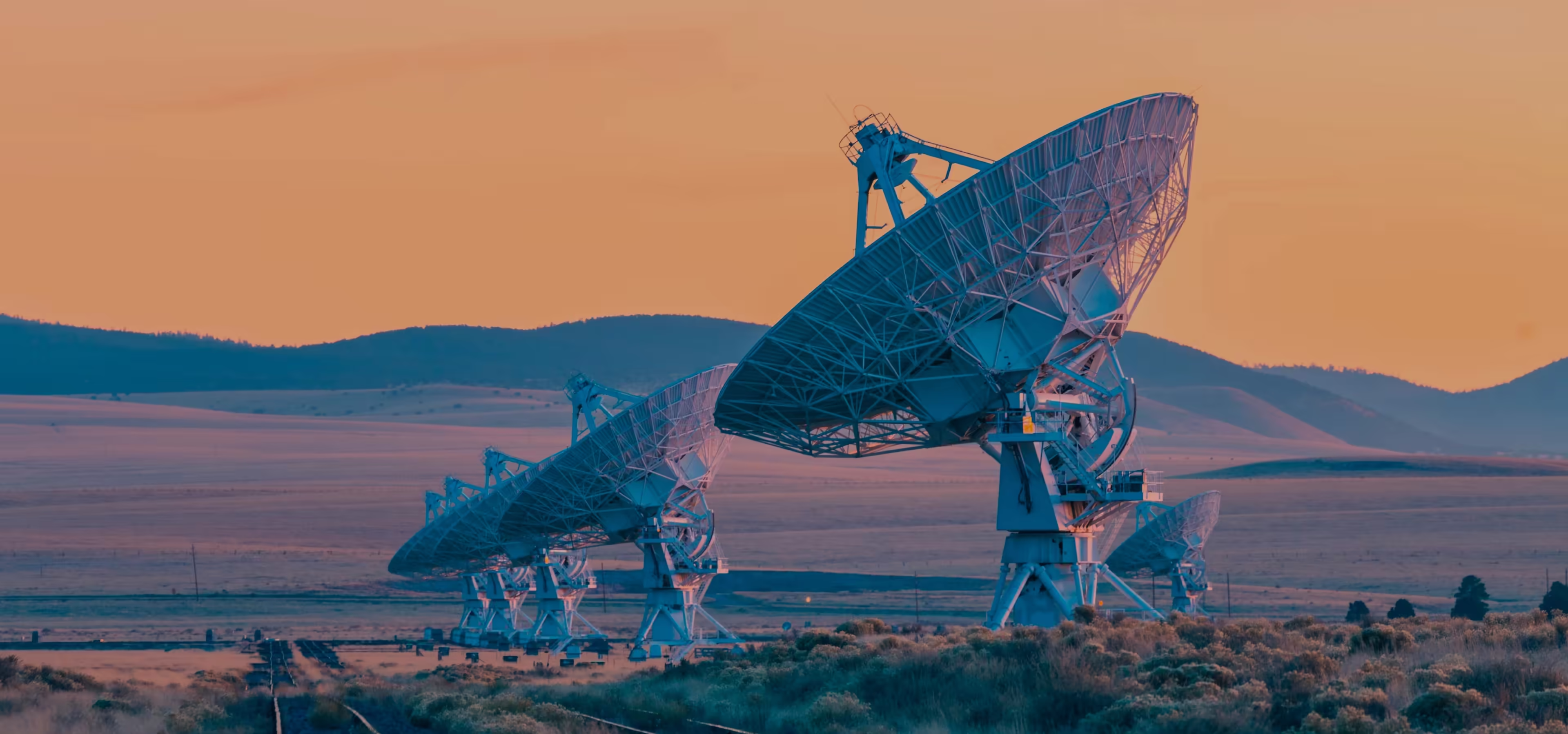 A few antennas are constructed somewhere in the desert. 