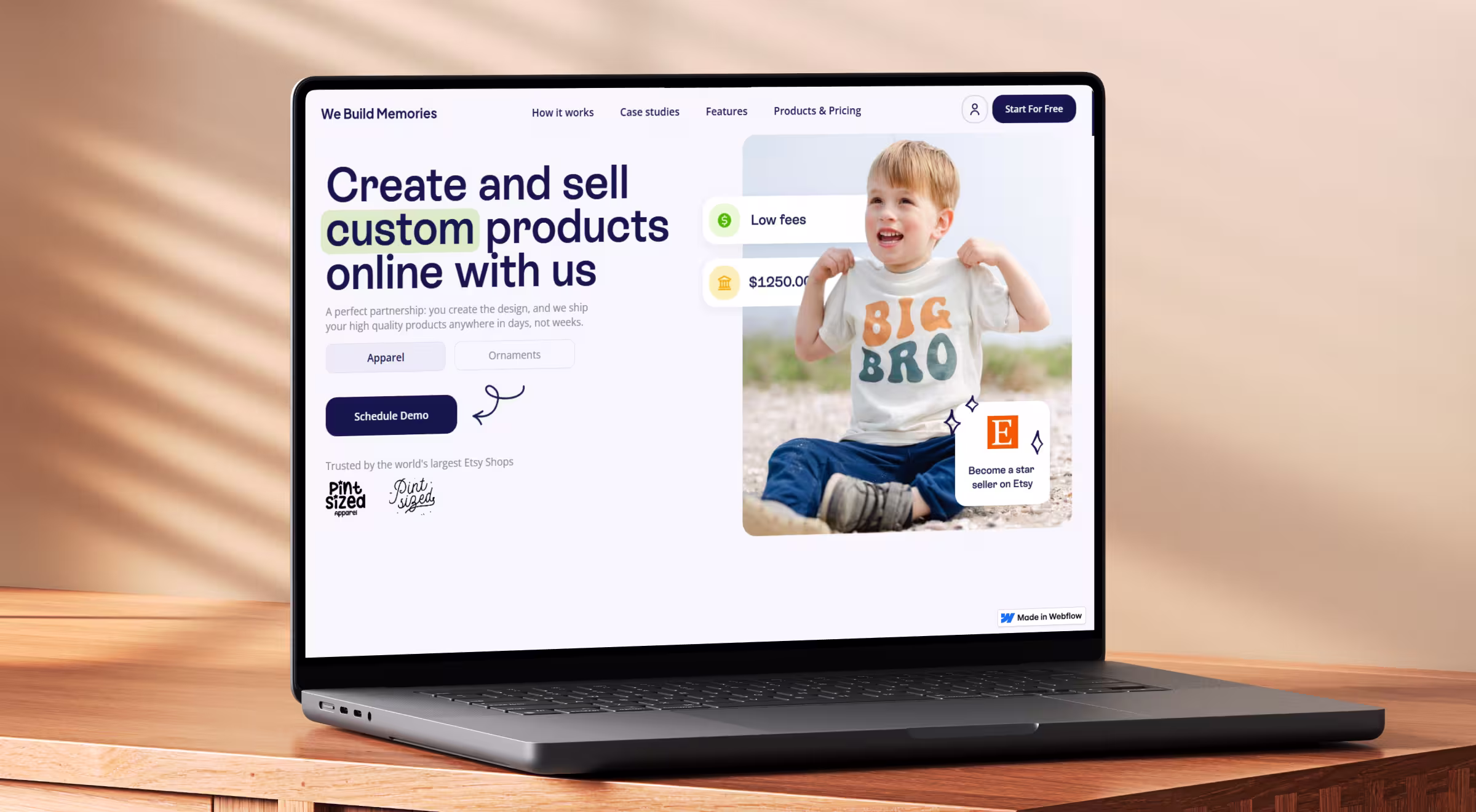 Custom product ecommerce website design on laptop screen, showcasing Webflow-built platform for selling apparel and ornaments with Etsy integration
