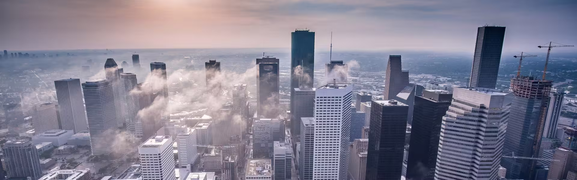 Foggy city skyline with skyscrapers symbolizing innovation and digital business growth