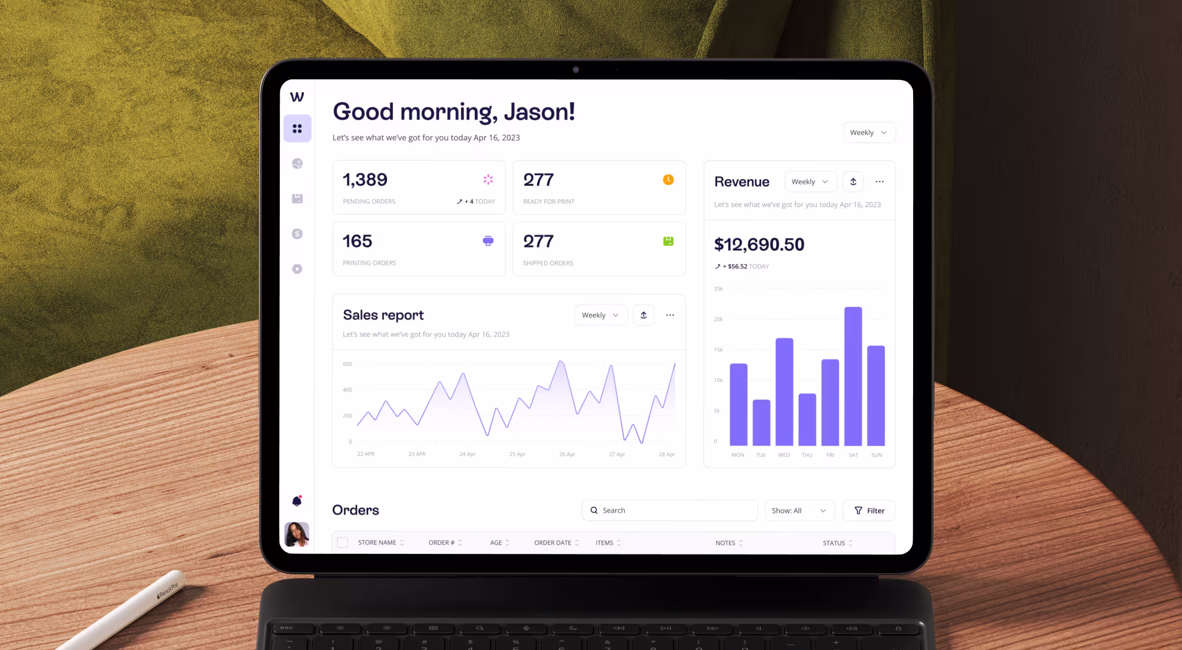 Tablet screen displaying modern analytics dashboard with sales report, revenue chart, and order metrics in a clean UX/UI design