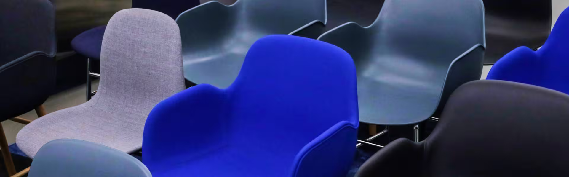 Empty modern chairs in a conference room prepared for a UX design workshop or business presentation