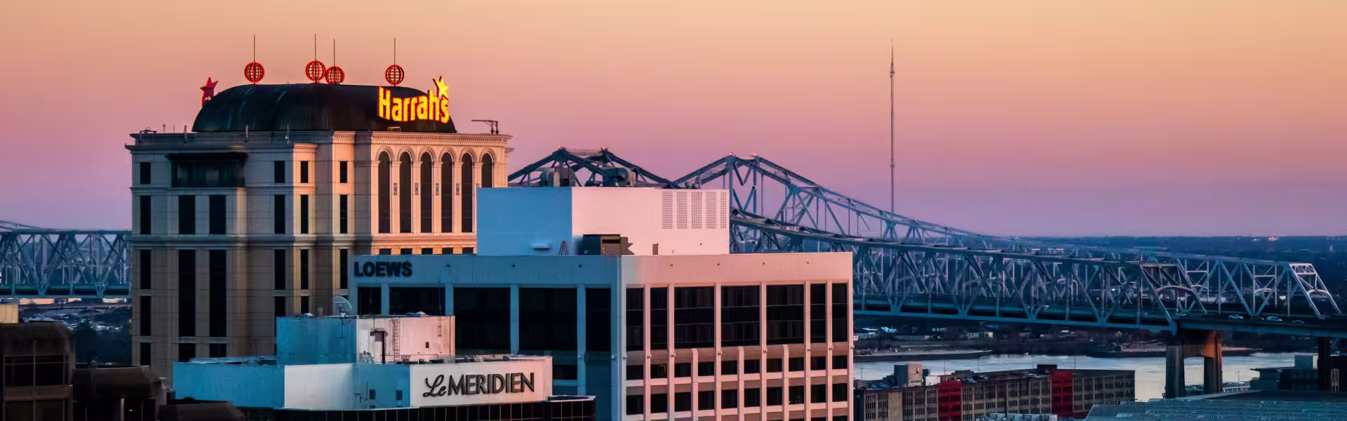 Downtown New Orleans skyline with Harrah’s and Le Meridien buildings at sunset — modern cityscape captured for web design and branding inspiration