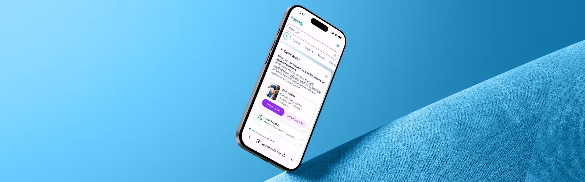 A smartphone resting on a blue background, showcasing its sleek design.