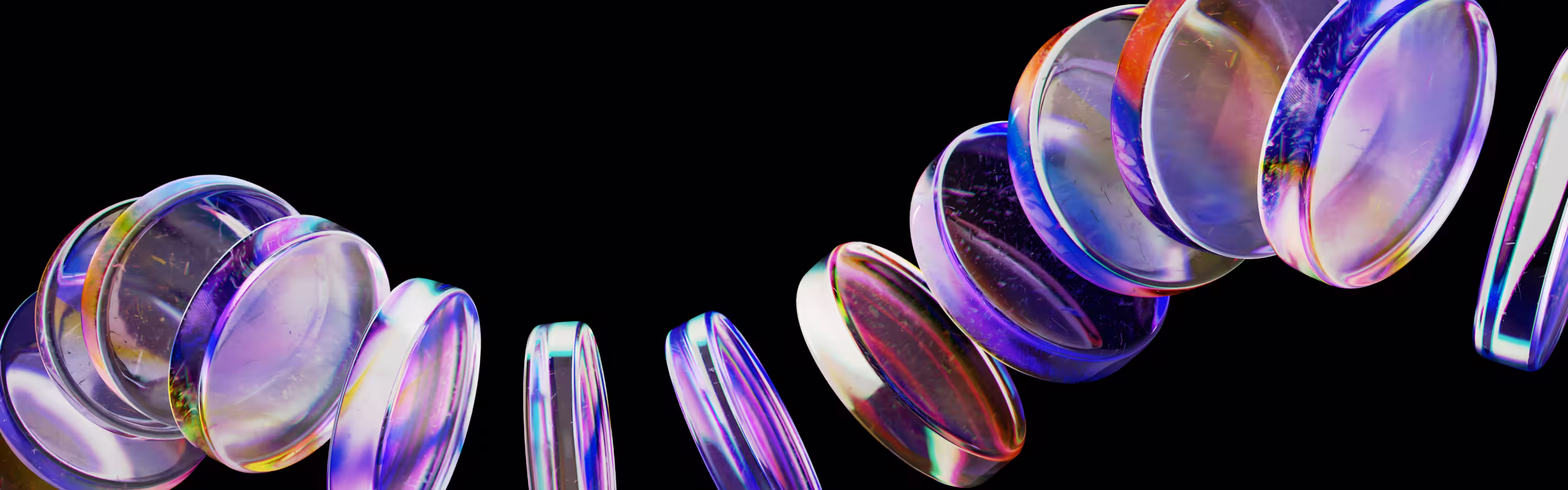 A vibrant array of translucent, colorful coins floating in a semi-circle against a black background, creating a dynamic visual effect.