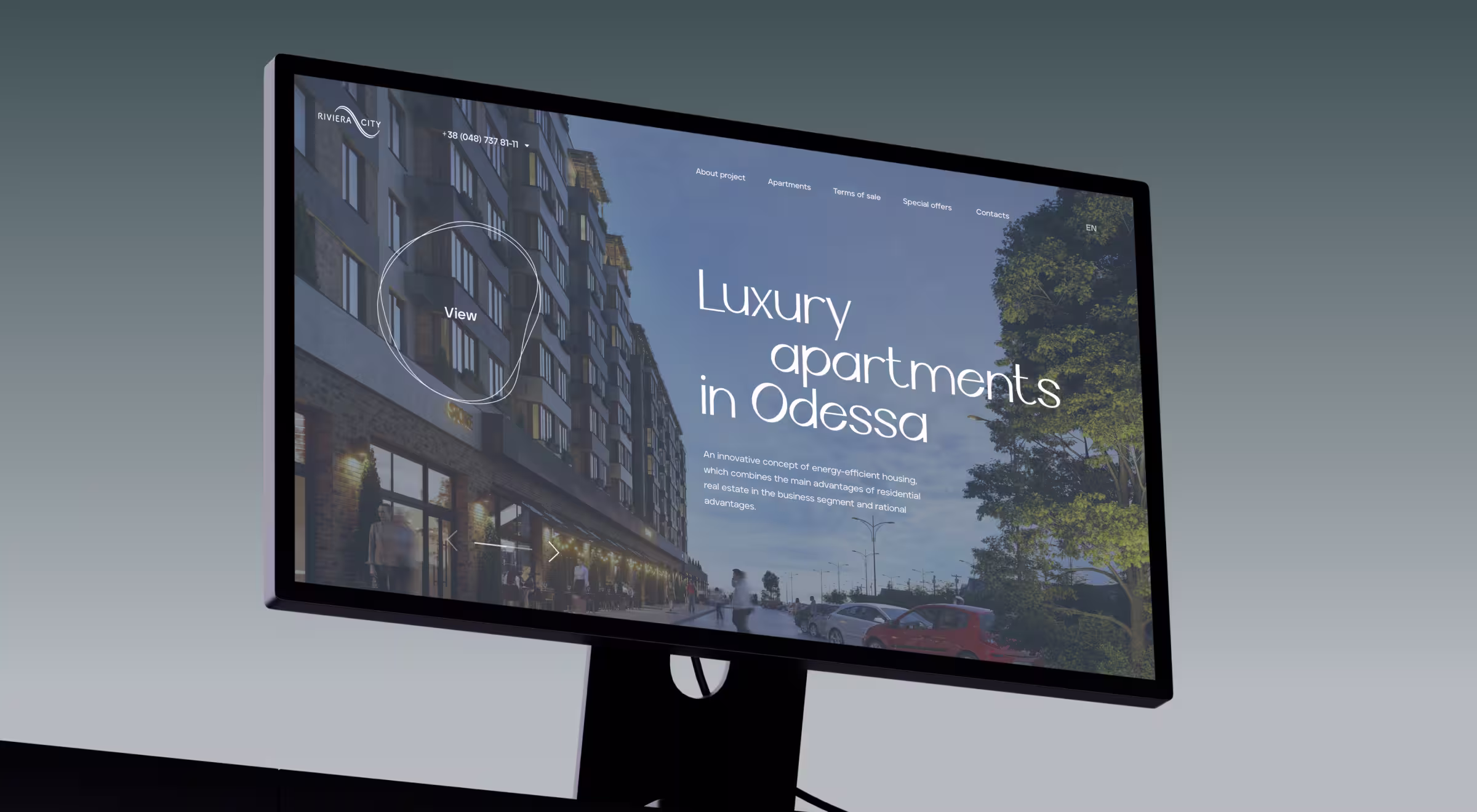 Desktop monitor displaying a real estate website showcasing luxury apartments in Odessa, featuring a building exterior and modern UI elements against a gradient background