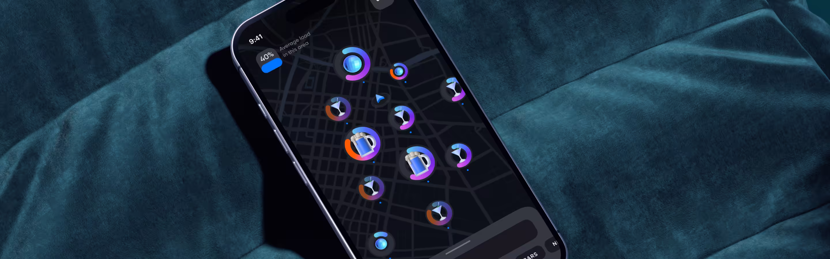 A smartphone displaying a dark map interface with colorful location icons, set on a soft, teal background.