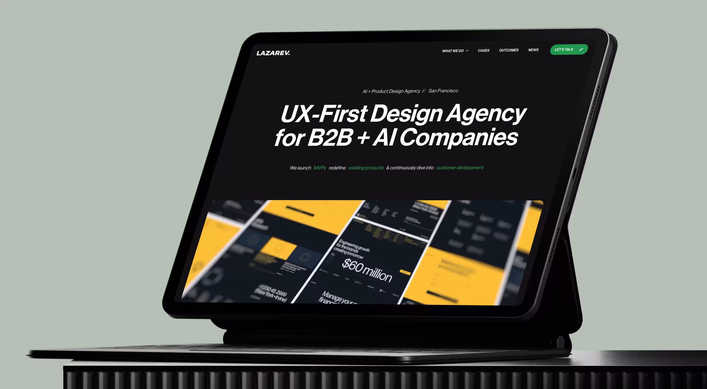 iPad displaying Lazarev.agency website hero section promoting UX-first product design services for B2B and AI companies, shown on a black stand against a muted green background