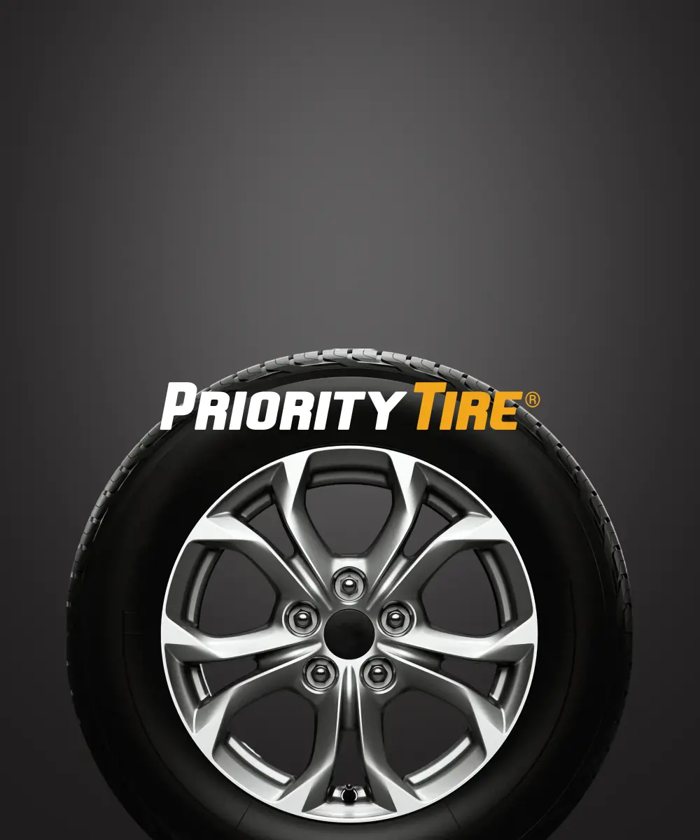 Logo design for "Priority Tire," featuring a sleek tire with an elegant wheel on a dark background.