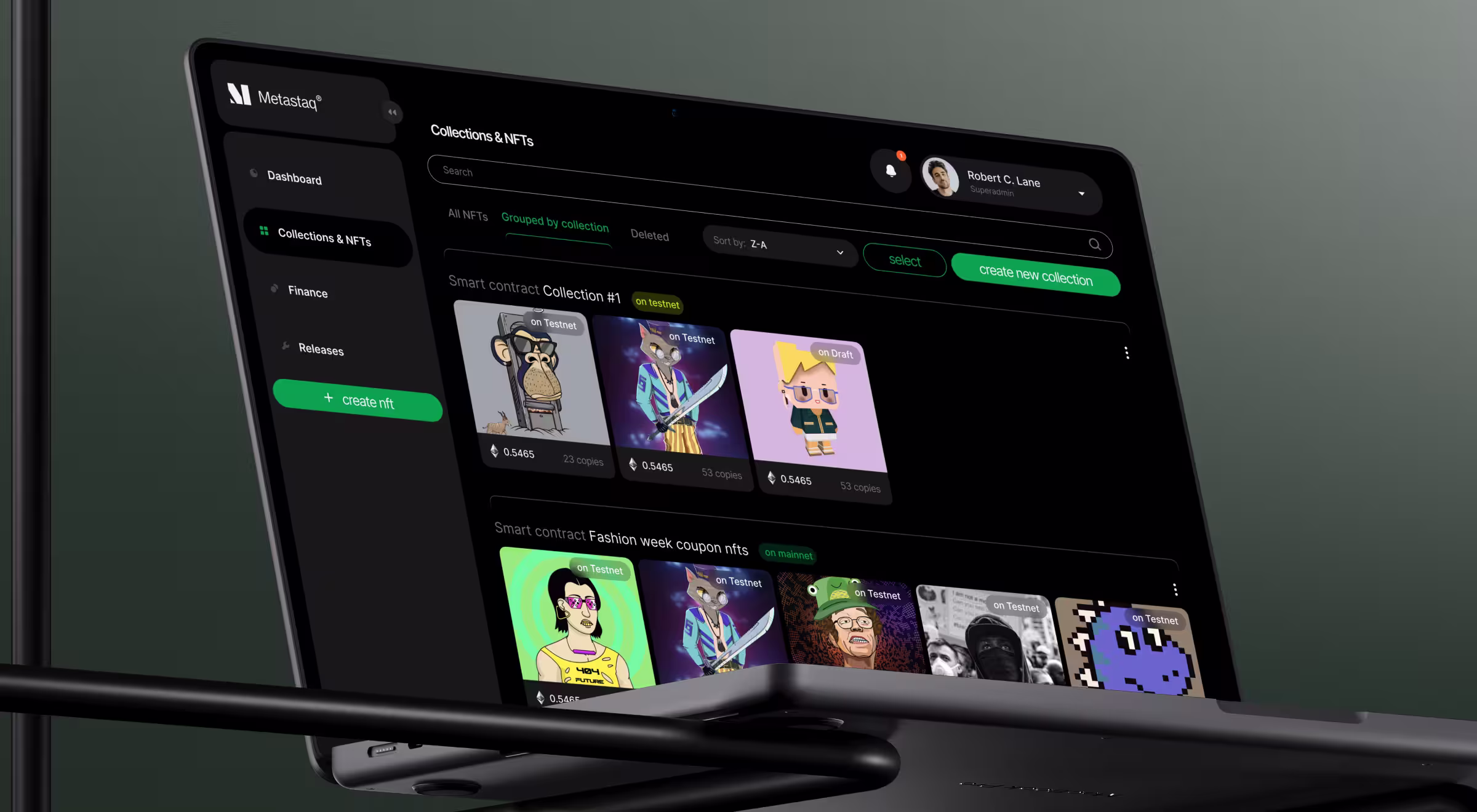 Laptop showing an NFT collections dashboard with grouped digital assets and smart contract controls