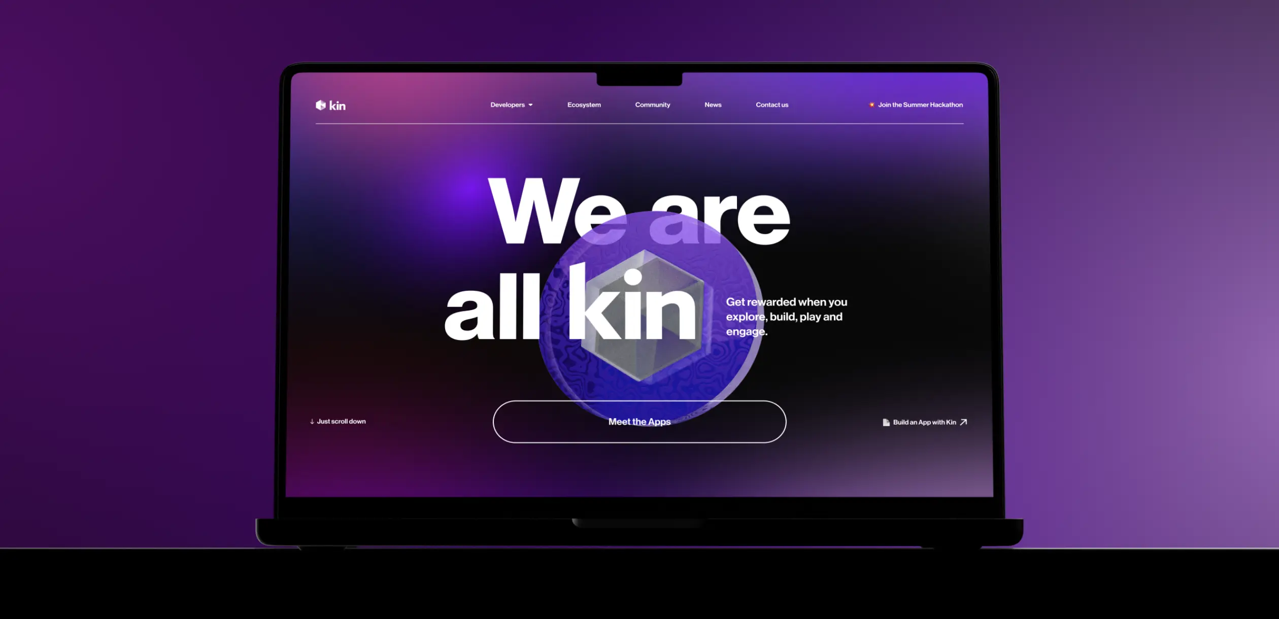 A laptop displays a vibrant purple webpage with "We are all kin" text, promoting community engagement and app development.