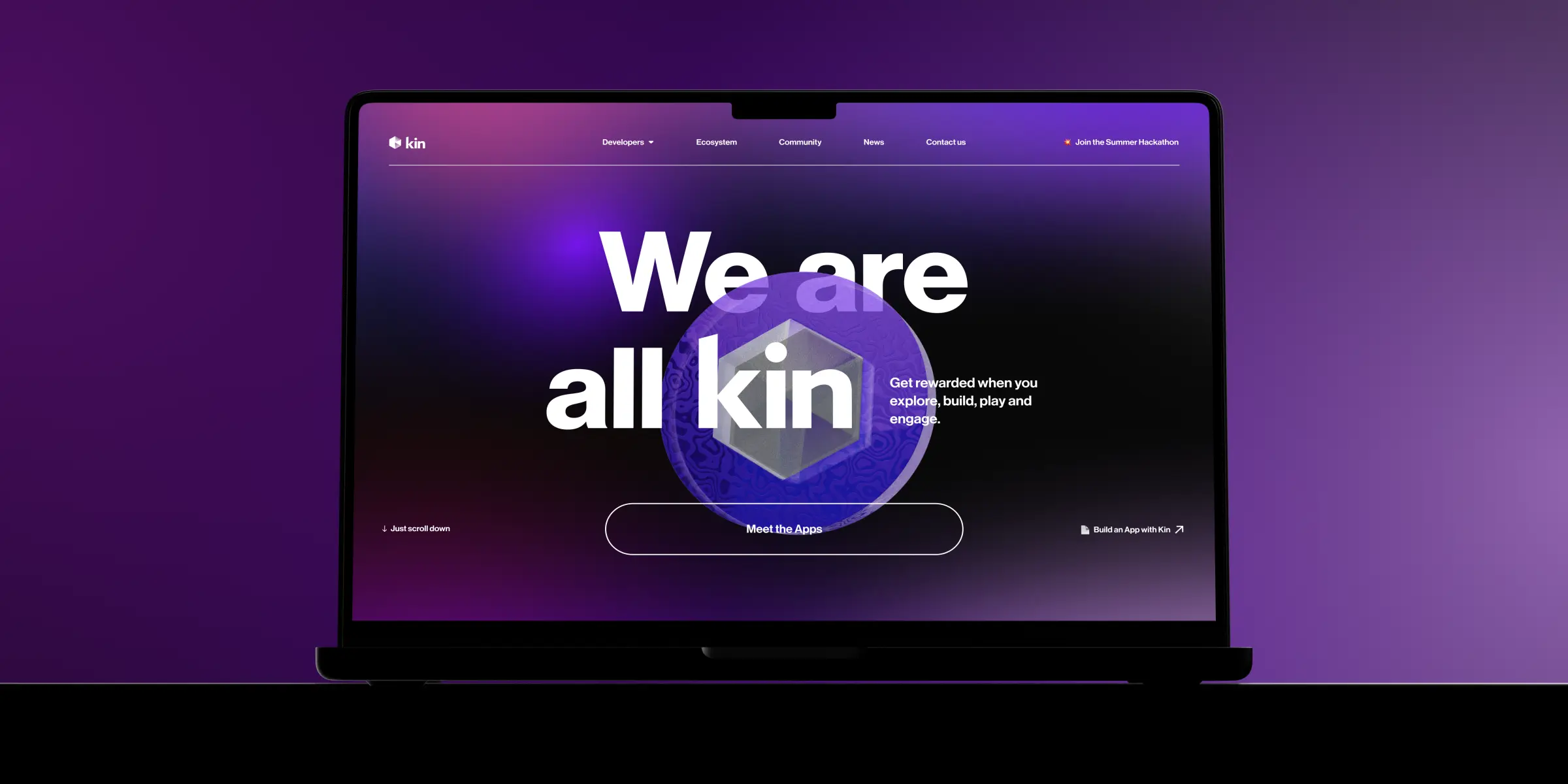 A laptop displays a vibrant purple webpage with "We are all kin" text, promoting community engagement and app development.