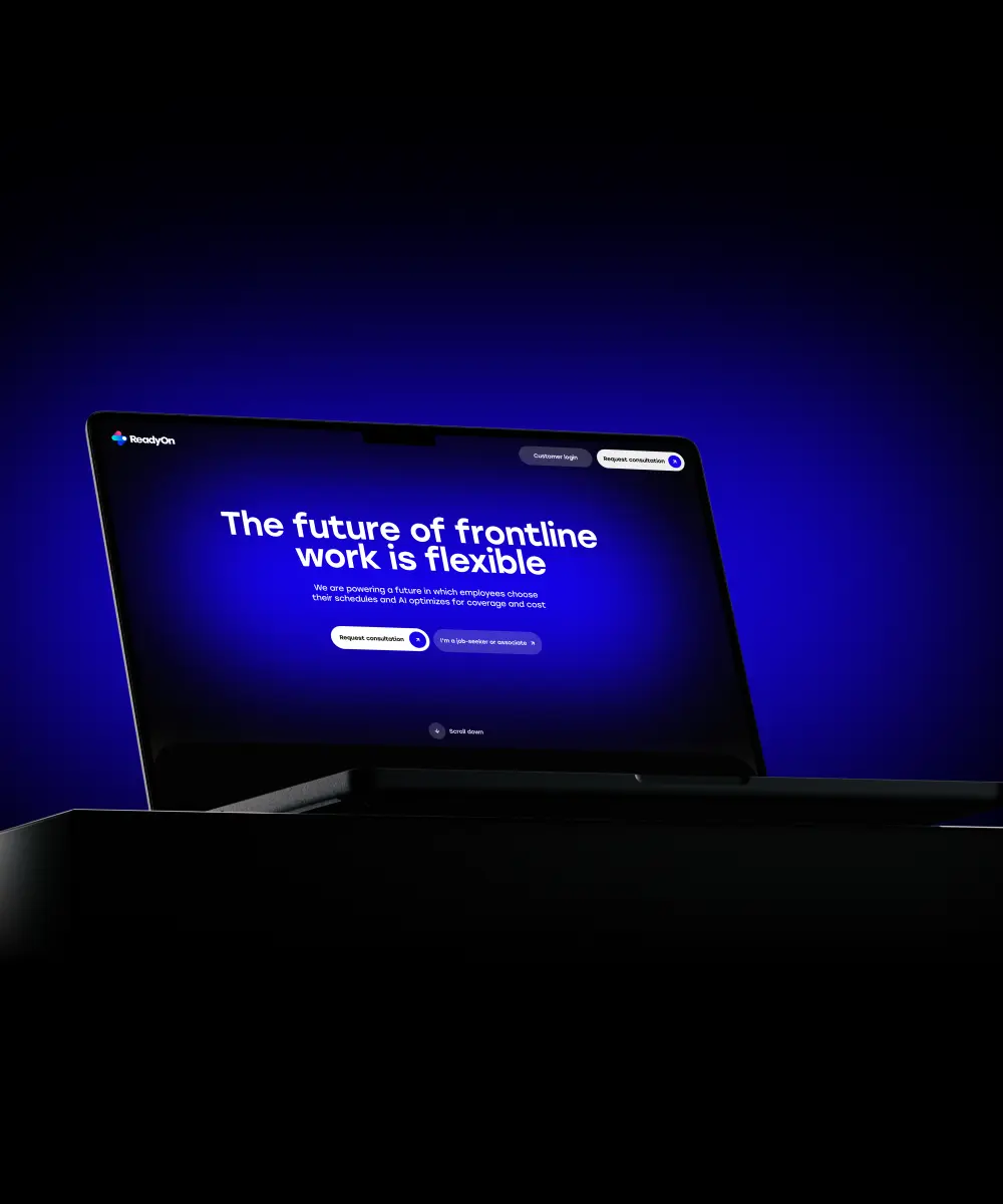 A laptop screen displaying a dark blue background with bold text about flexible frontline work and options for consultation and job seekers.