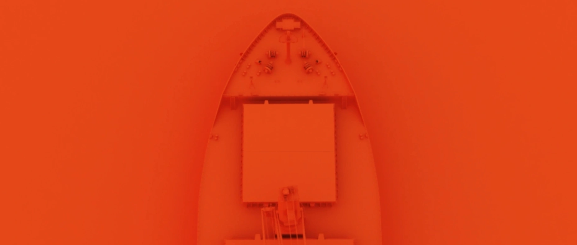 Top-down aerial view of a cargo vessel moving through open water, representing maritime transportation, bulk cargo logistics, and the global shipping infrastructure that supports international trade.