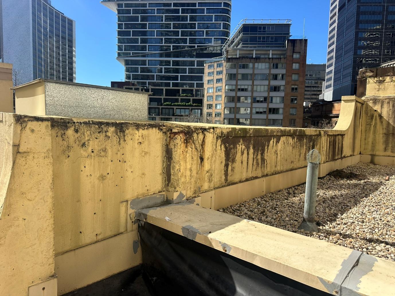 Balcony waterproofing area requiring inspection for water penetration issues.