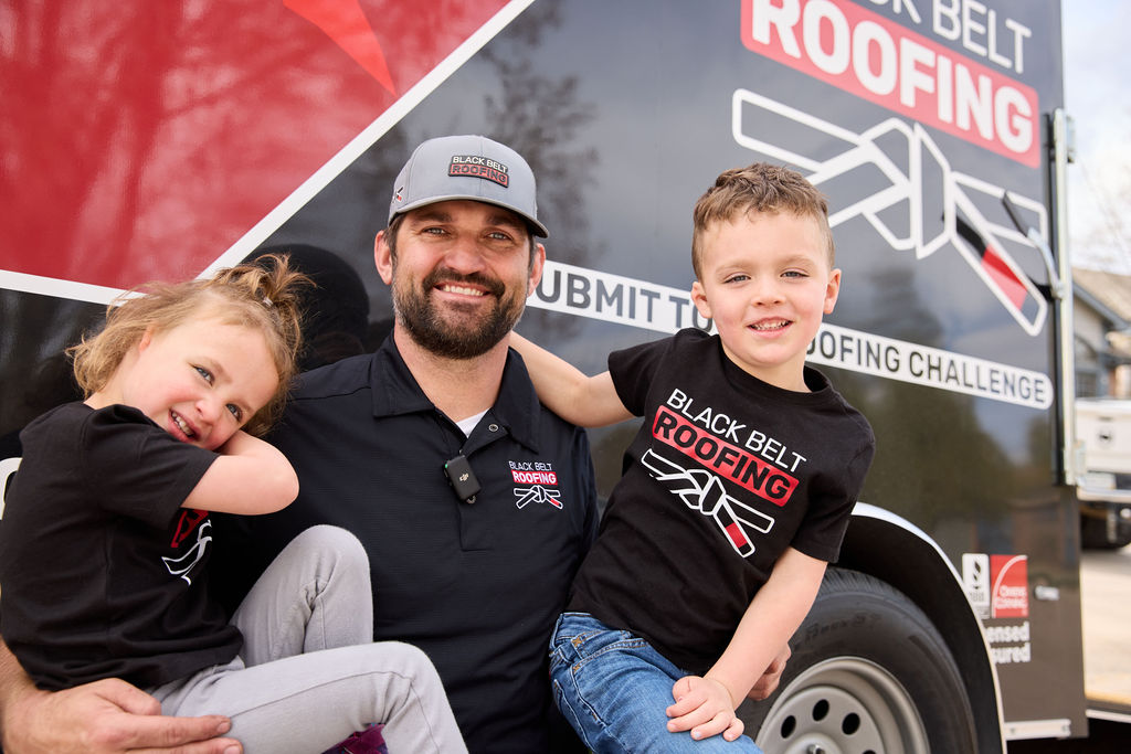 Black Belt Roofing owner with children representing family-owned roofing company