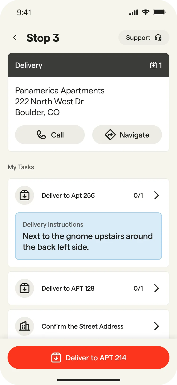 Mobile app screen showing delivery stop details with apartment address, delivery tasks, instructions, and a red ‘Deliver to APT 214’ button at the bottom.