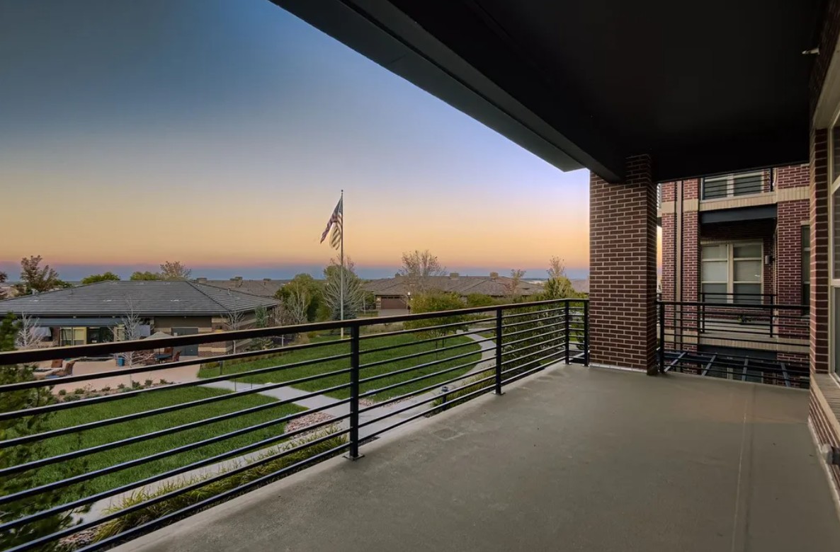 Amberely balcony with view of walking path and flag pole