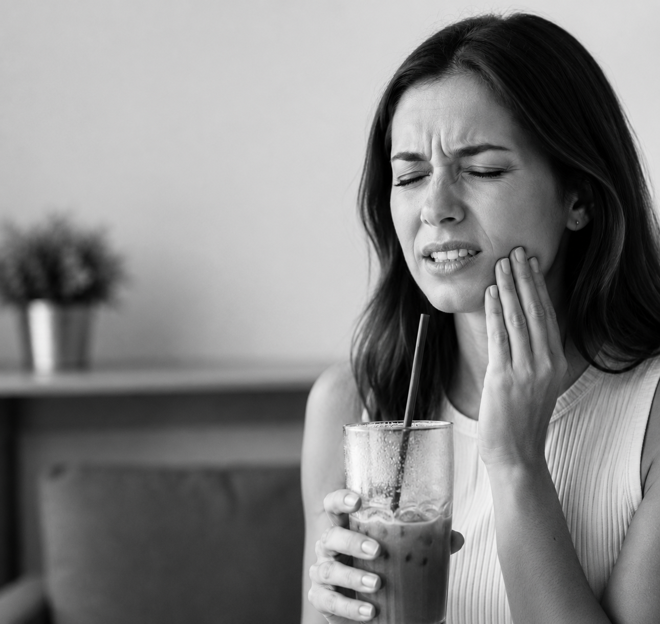 Woman suffering from tooth sensitivity