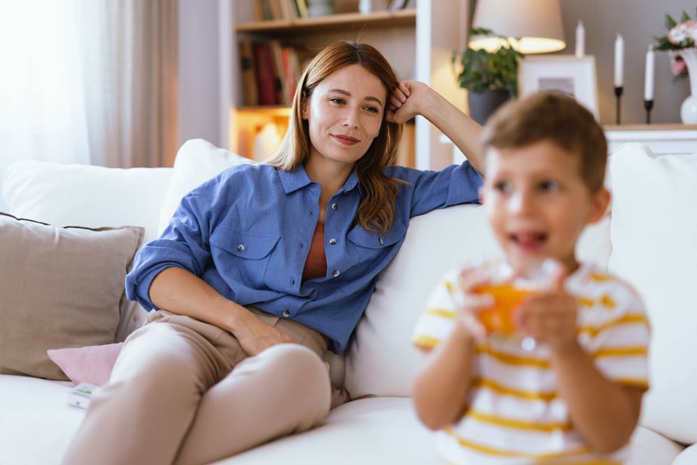 Mother watching her young child at home, symbolizing the importance of ADHD testing and parental involvement.