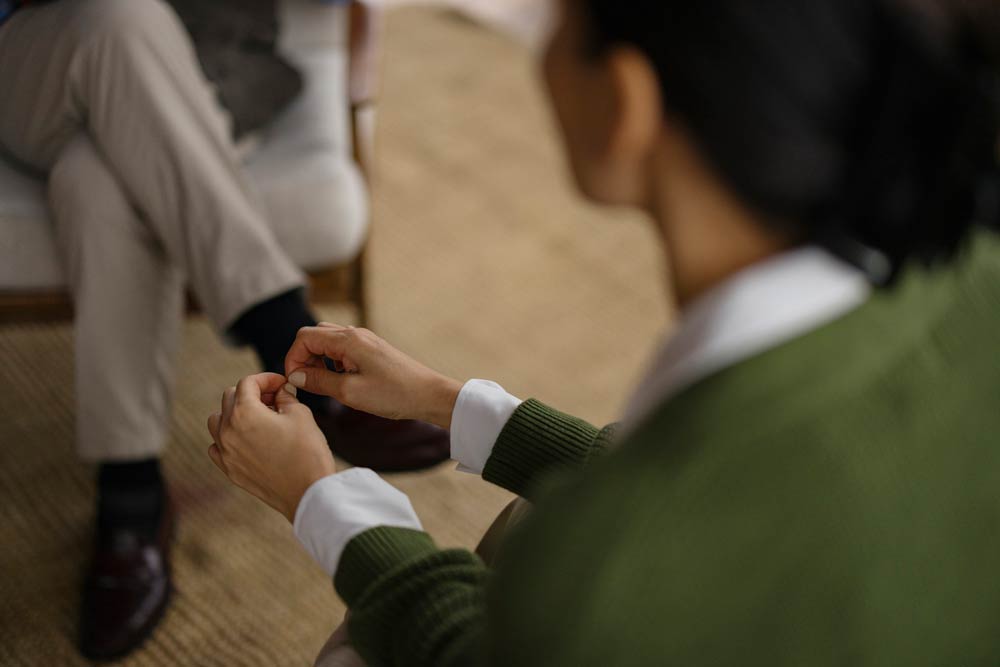 Person in conversation with a therapist, representing the distinction between ADHD coaching and therapy in supporting emotional and practical growth.