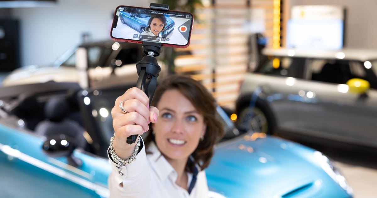 Service technician recording a video MPI of a wheel on a lifted car in the workshop