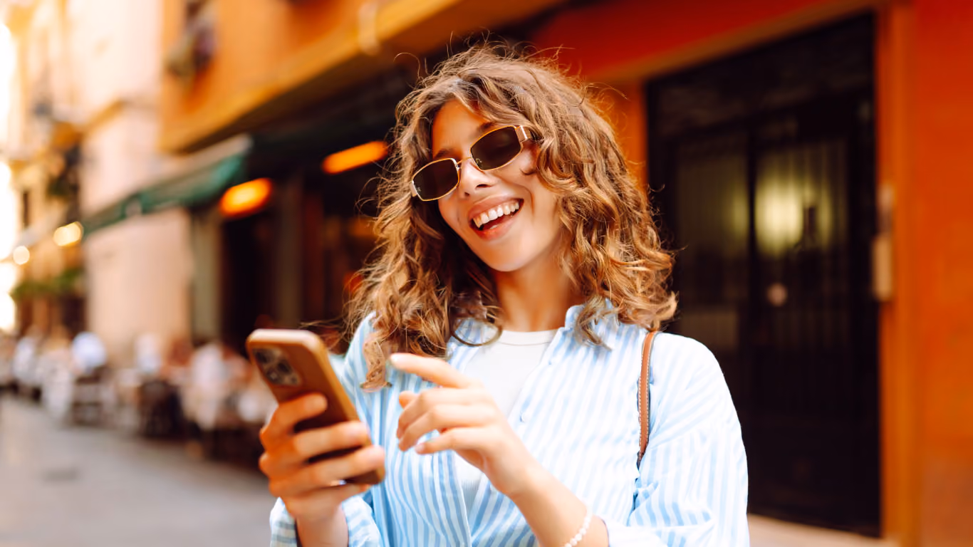 happy women checking her phone.