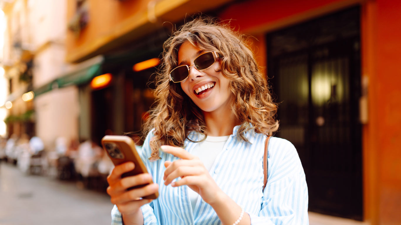 happy women checking her phone.