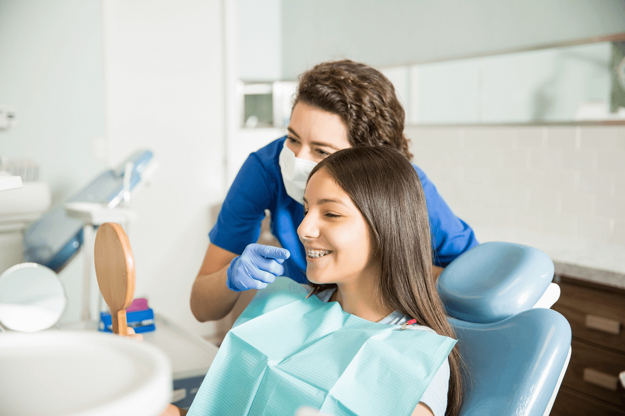 A teen girl visits the best pediatric dentist in Anchorage for a back-to-school dental checkup